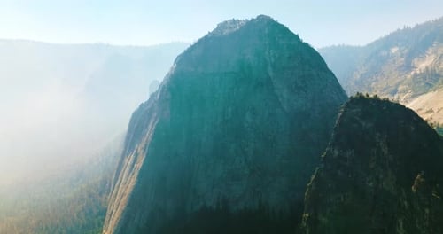 Bare cliff rock of Yosemite National Park, California, USA. Deep haze covering the horizon