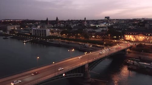Magic hour Drone flight over Mainz Germany crossing the old bridge showing the old city and the Dom