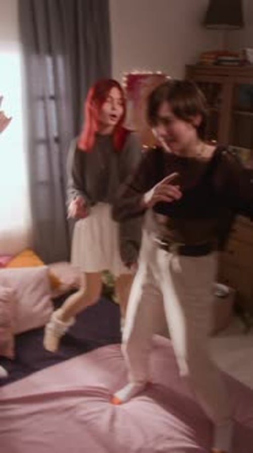 Young Adults Dance Together in Bedroom