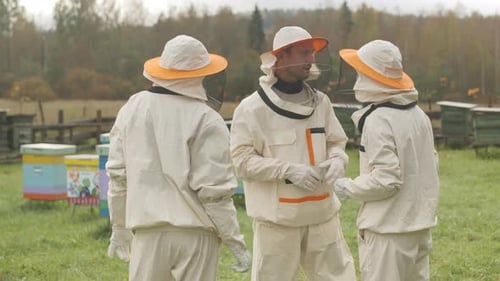 Beekeepers Talking at Apiary