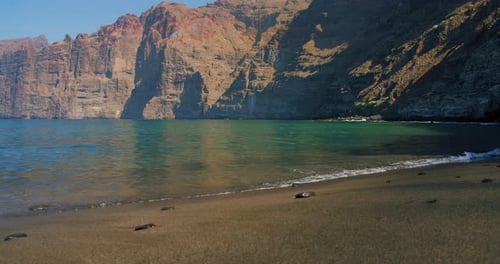 Los Gigantes cliffs, sunrise on Tenerife, Canary Islands, Spain. Volcanic sand beach ocean, Playa de
