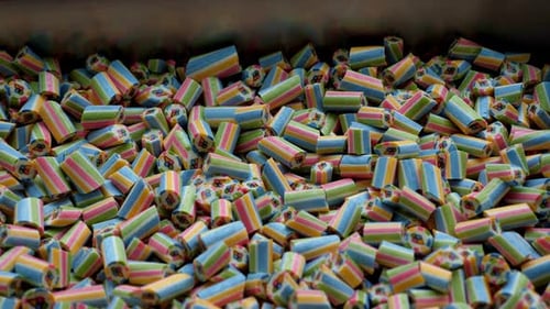 A Lot of Small Colored Caramel Candies in a Metal Container in a Confectionery