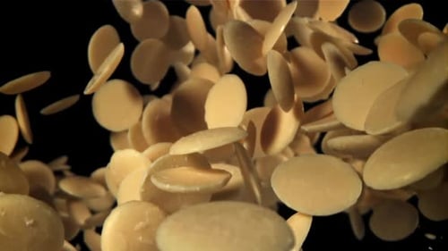 White Chocolate Chips Fly and Fall Filmed on a Highspeed Camera at 1000 Fps