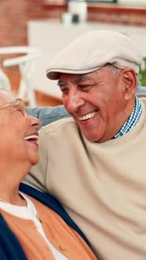Senior Couple Share a Laugh at Home