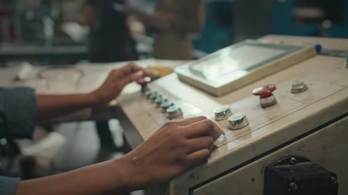 Female Hands Operating Industrial Machine Equipment at Factory