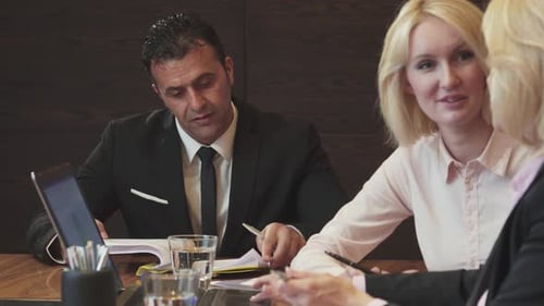 Dynamic Business Meeting in a Modern Office Setting