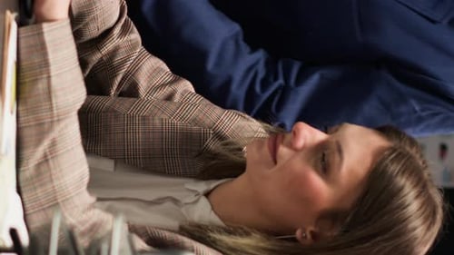 Colleagues Collaborate on Project in Modern Workplace