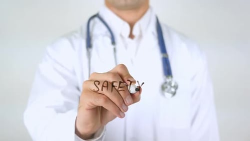 Doctor Writing Safety Message with Pen