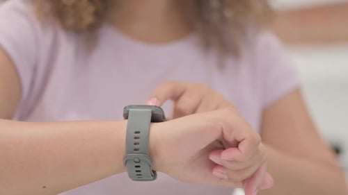 Close up of African Female Hand Using Smartwatch