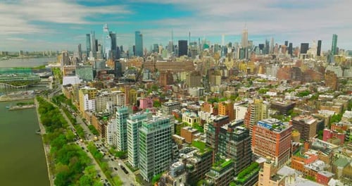 Sunny New York quarters with diverse architecture. Aerial view of metropolis with skyscrapers