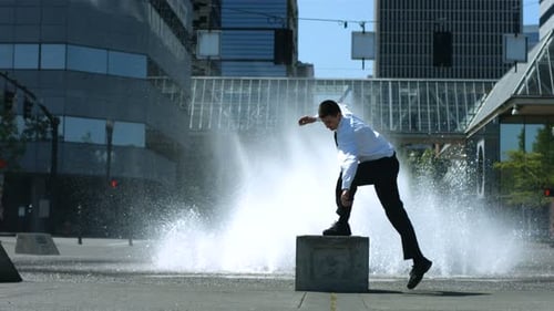 Business Man Does Flip in Front of City Fountain 20-25