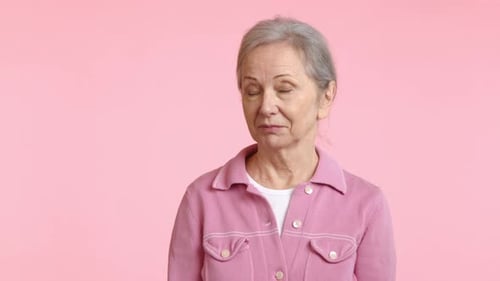 Senior Woman with Grey Hair Looking at Camera