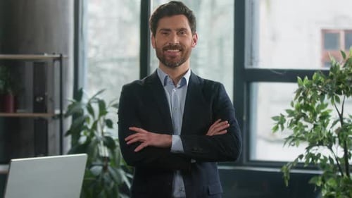 Successful Smiling Caucasian Businessman Entrepreneur Posing in Office with Crossed Arms Confident