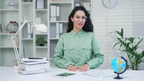 Webcam view Young pleasant woman teaching school lesson remotely, private tutor teacher talking on v