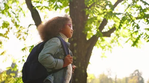 Schoolgirl with School Bag Back to School