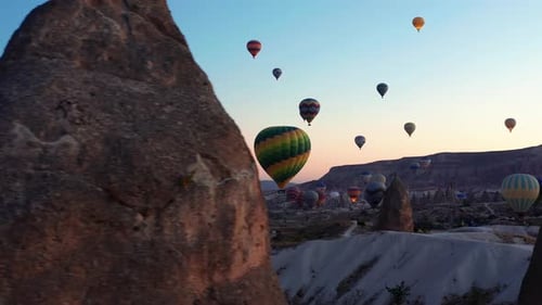 Early morning silhouetted hot air balloons against the skies of Goreme Cappadocia, Turkey