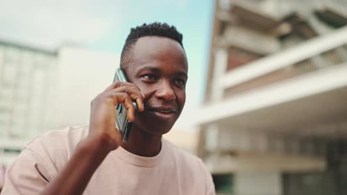 Clouse up, smiling happy young student sitting outside of university talking on cellphone