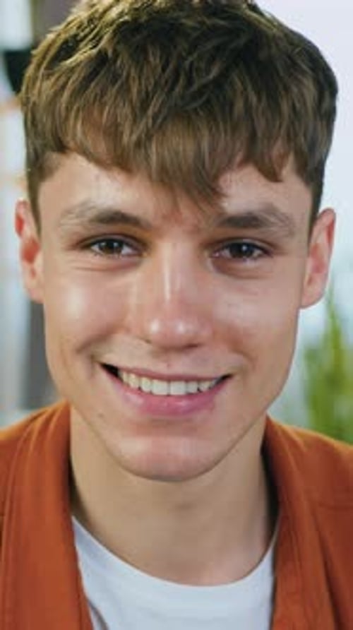 Goodlooking Positive Modern Relaxed 2025Aged Man in Trendy Clothes Posing on Camera with Sincerely