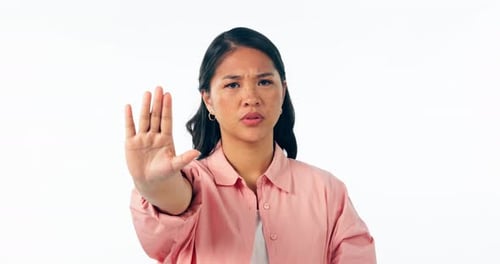 Stop, hand and face of woman in studio with dont, warning or no, threat