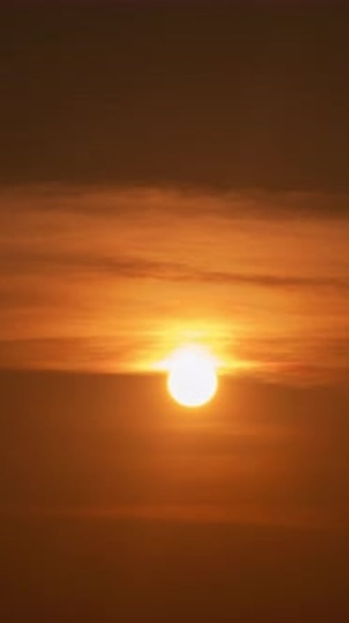 Brilliant Orange Sunset with Soft Cloudscape