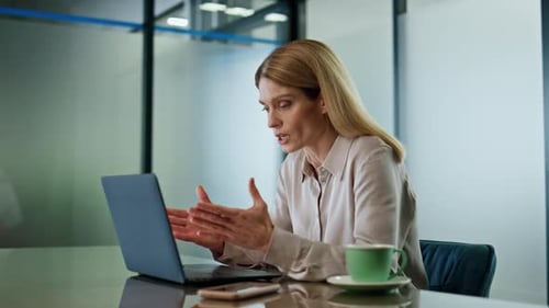Professional Woman Video Conferencing at Modern Office Workplace