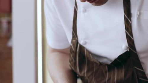 Chef prepares exquisite meat dish with delicate sauce