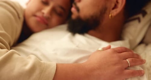 Affectionate Couple Cuddling and Sleeping in Bed