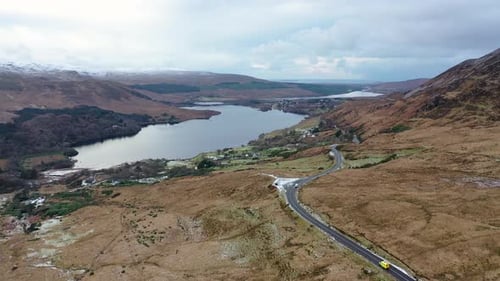 The R251 Next to the Snow Covered Mount Errigal the Highest Mountain in Donegal Ireland