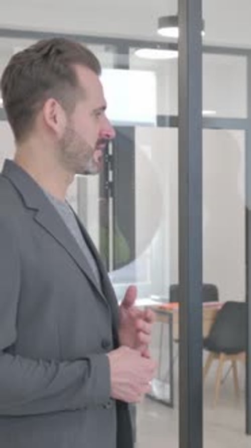 Mixed Race Entrepreneurs Discussing Business while Standing in Office, vertical video