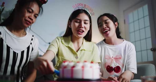 Friends Celebrate Birthday With Cake in Cozy Home
