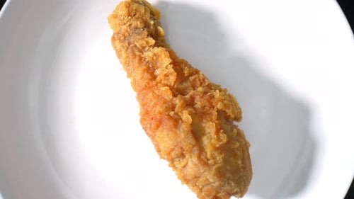 Crispy Fried Chicken Drumstick on White Plate