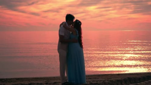 Couple Kissing at Sunset. Couple Beach Sunset. Love Couple at Sea Sunset