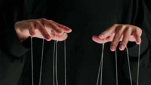 The Puppeteer Controls the Puppets in the Theater Managing People at Work in Politics and Government