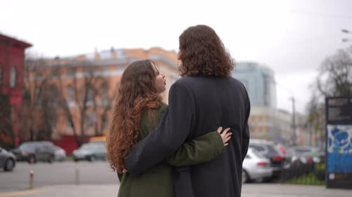 Loving Young Couple Embrace in City Street