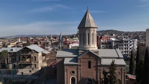 Aerial view of Holy Trinity Cathedral Sameba in Tbilisi Georgia. Sunrise drone footage.