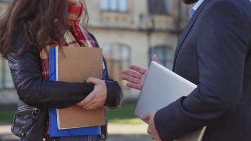 Closeup Professor Hand Supporting Female Student in Front of College