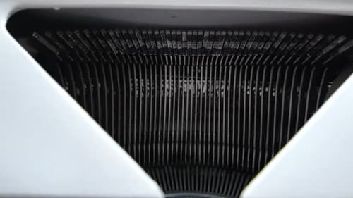 Typing on a white typewriter, slow zoom out camera move.