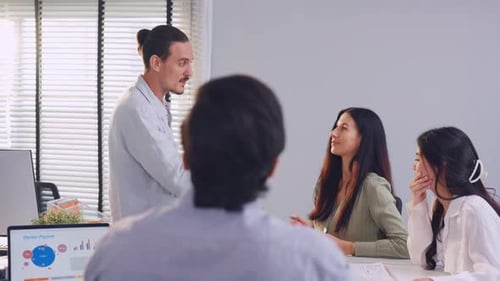 Group of Asian businessman and businesswoman working in the office.