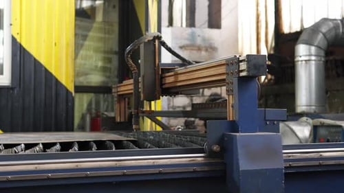 Plasma cutting of metal on a CNC machine. Manufacturing of industrial metal parts using a computer.