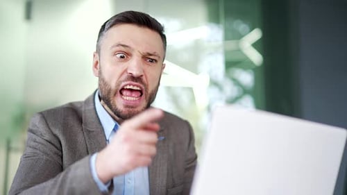 Angry Man Yelling in an Office Workplace