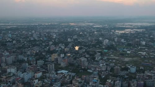 Aerial: city view of urbanization with dense buildings - top zoom out shot