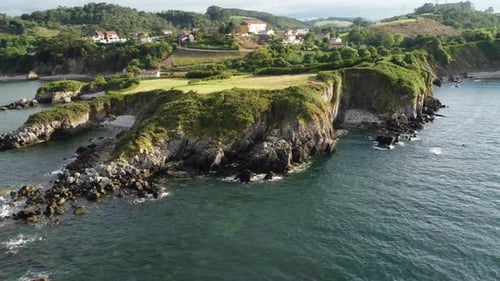 Aerial view flying around a rocky coast