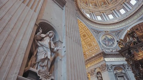 Stunning interior view of St. Peter’s Basilica in the Vatican, showcasing its ornate dome, marble