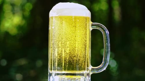 Refreshing Mug of Beer with Bubbles and Foam