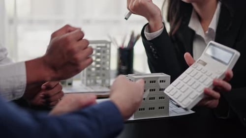 Businesspeople sell buy mortgage and signing agreement for apartment financial