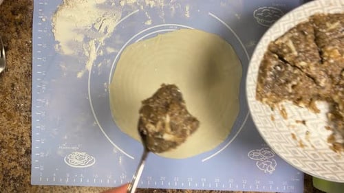 Preparing patties with ground beef and the process of forming a patty from raw dough. Top view.