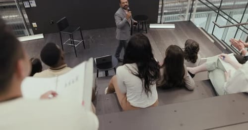 Business presentation with speaker in modern office space