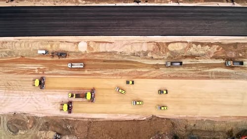 Birds Eye View of Heavy Machinery Constructing a New Highway