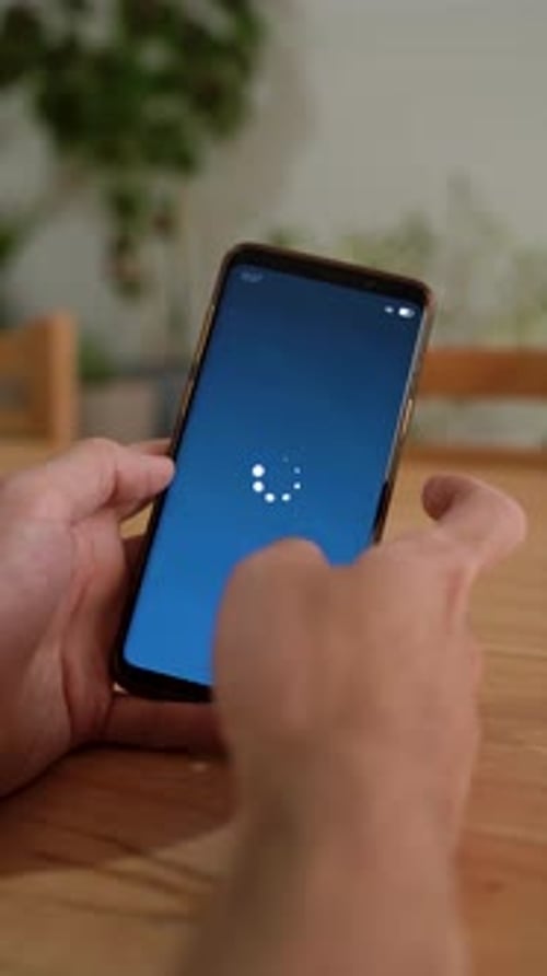 Hands Holding Smartphone Showing Connection Established Indoors