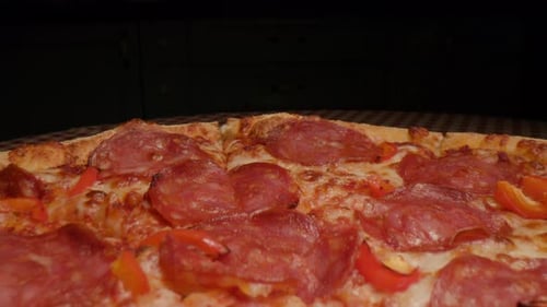 Freshly Baked Pizza with Salami and Peppers